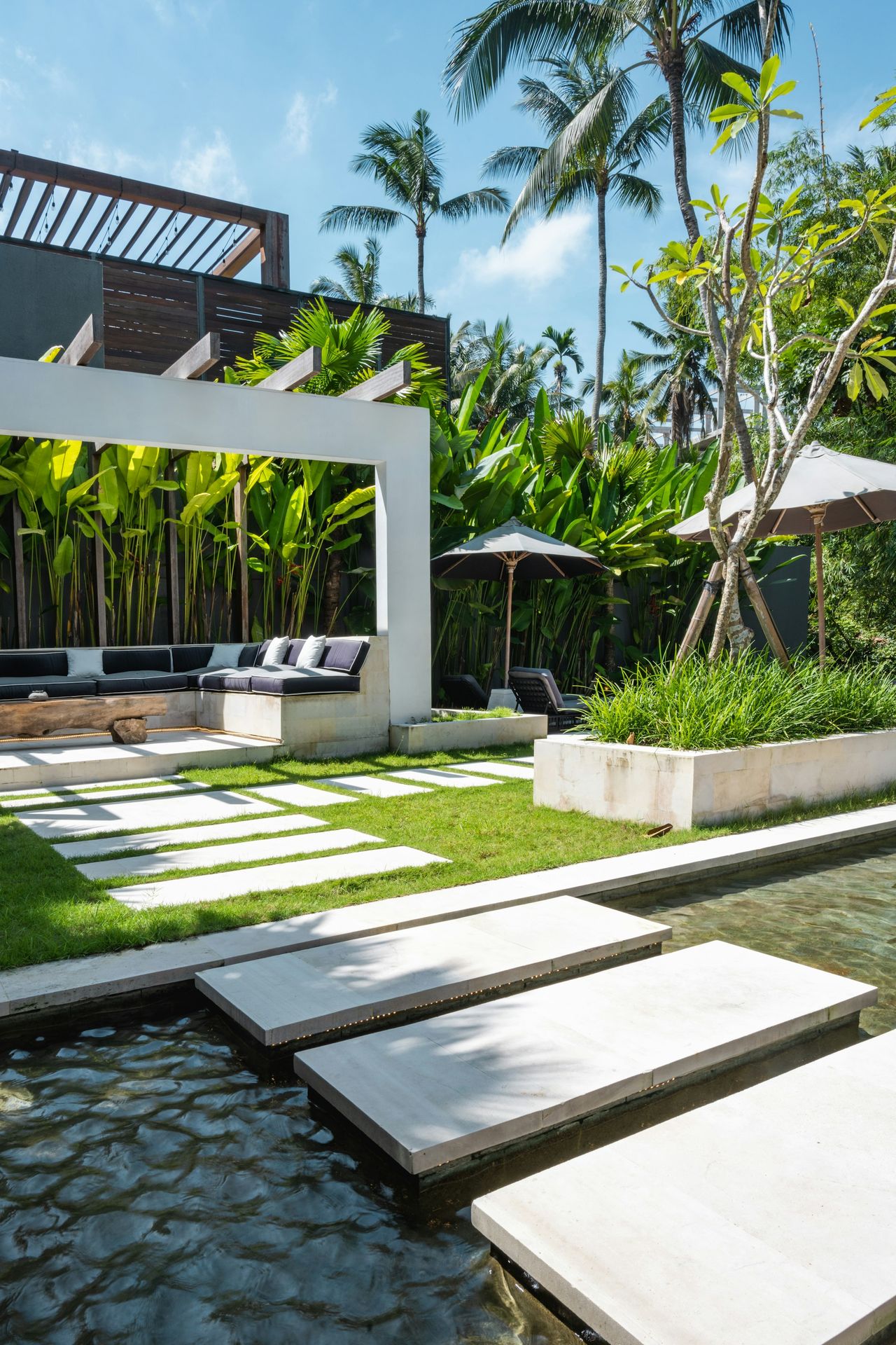 A modern house with a pool in the middle of it